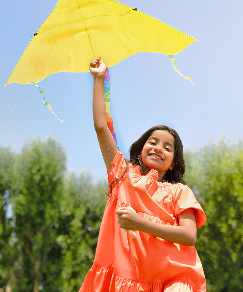 Girl flying kite